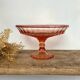 Pink glass cup, fruit bowl