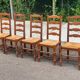 4 or 5 solid wood chairs with light oak straw and high backs