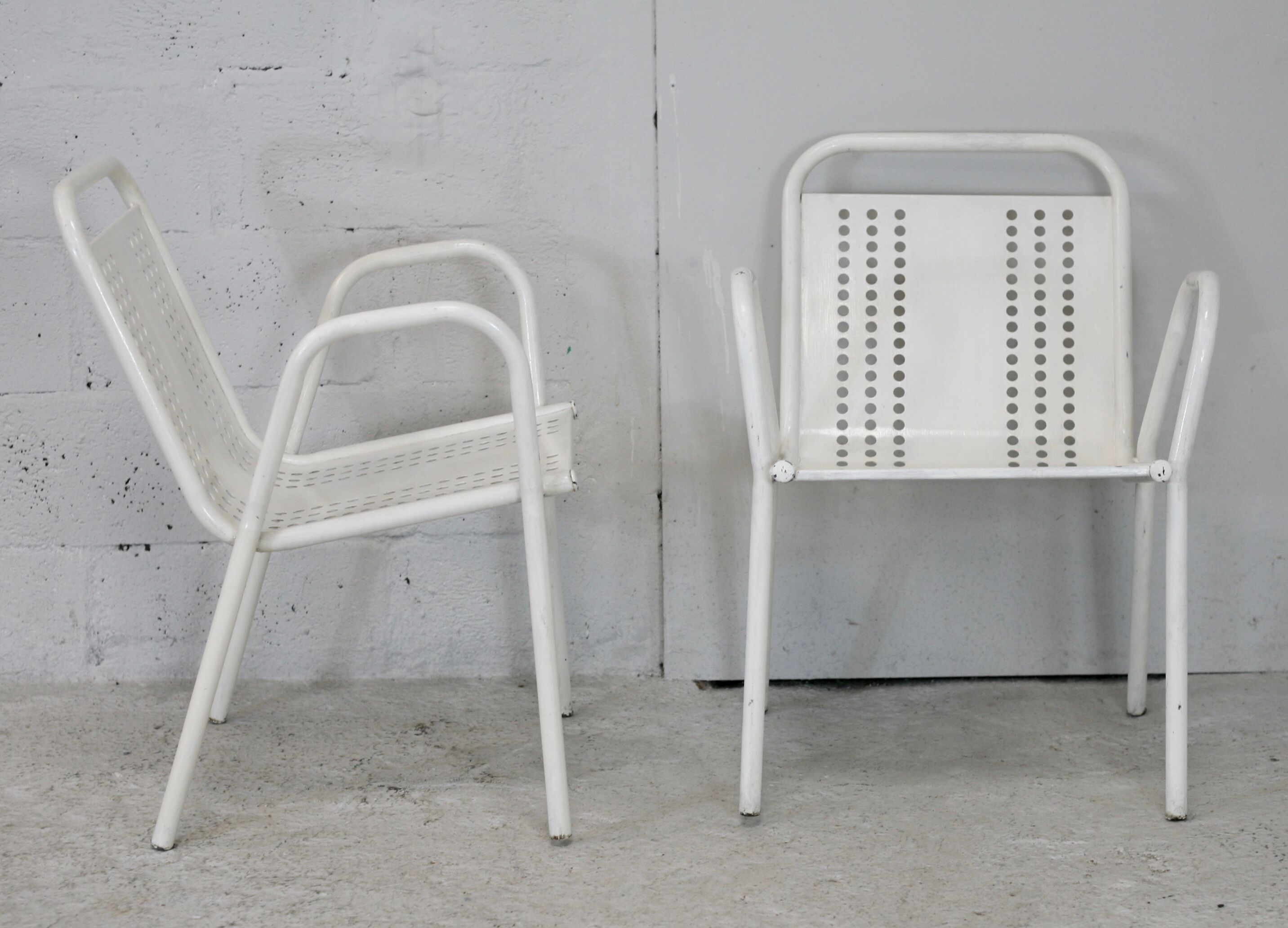 Pair of honeycomb steel armchairs. France, circa 1950.