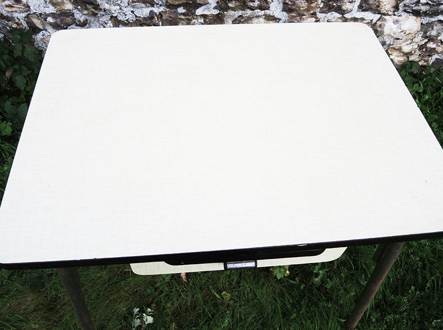 Old extendable table in yellow formica