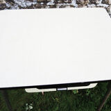 Old extendable table in yellow formica