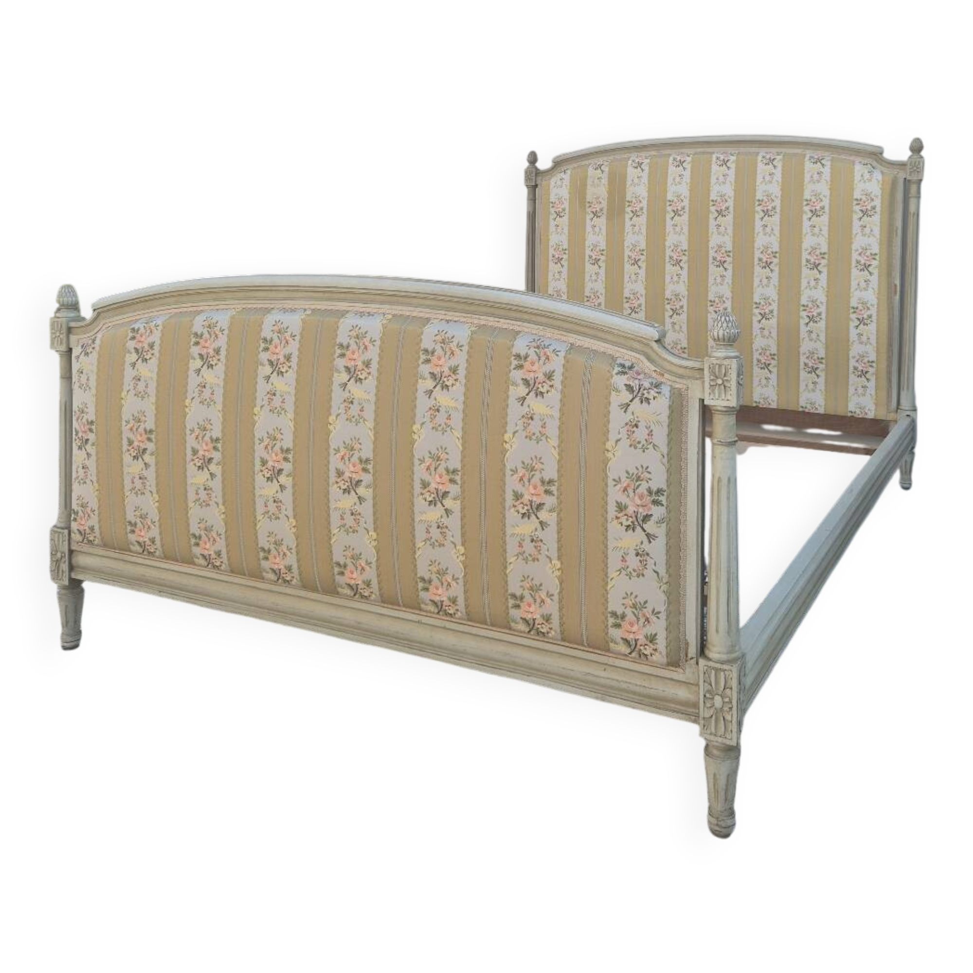 Louis XVI style bed richly decorated in patinated wood.
