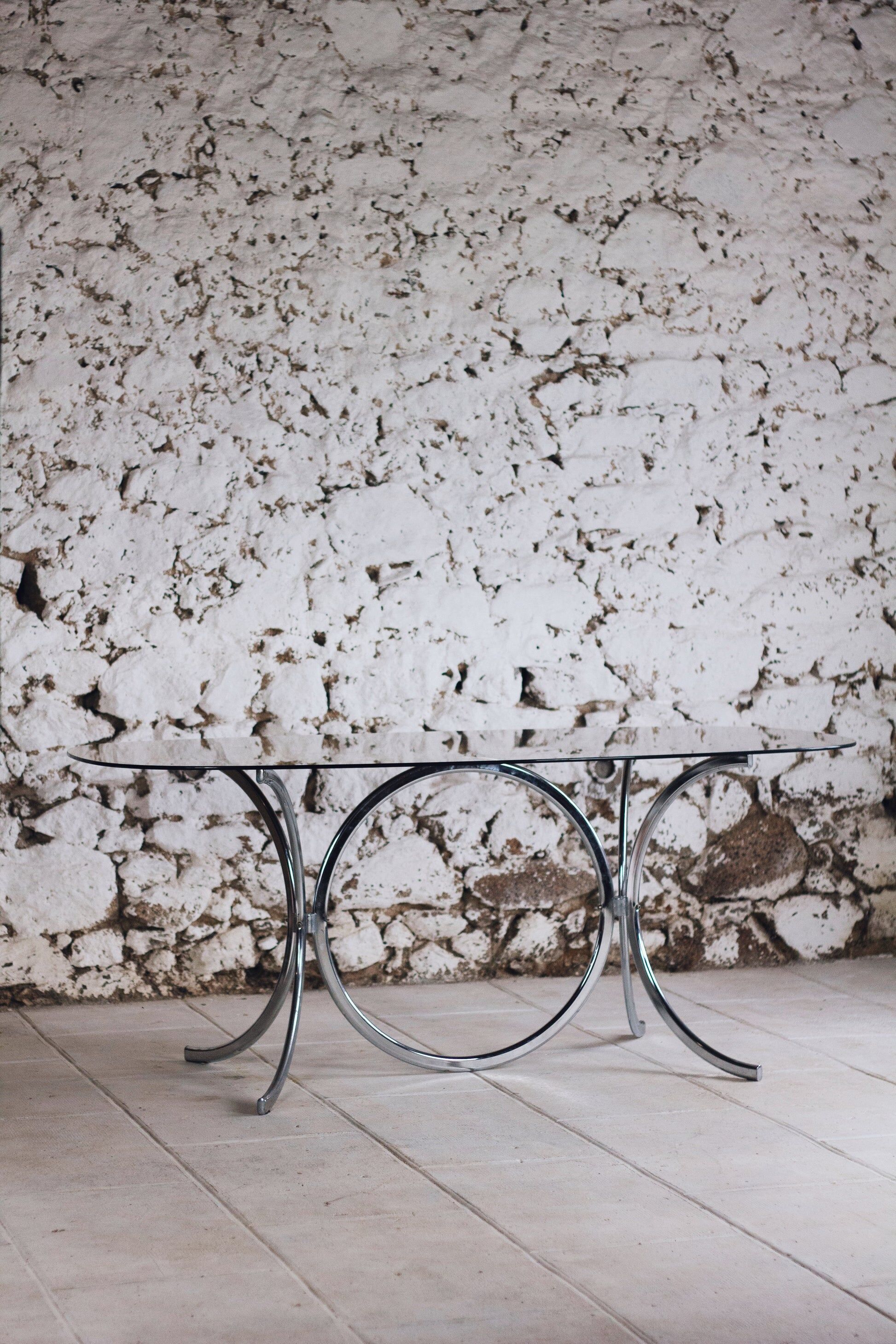 Chrome and smoked glass dining table in the style of Gastone Rinaldi, 1970.