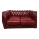 Red two-seater chesterfield sofa