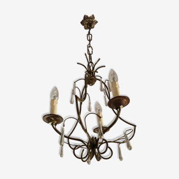 Old chandelier in gilded metal and stamps