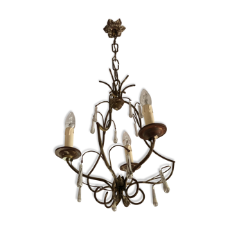 Old chandelier in gilded metal and stamps