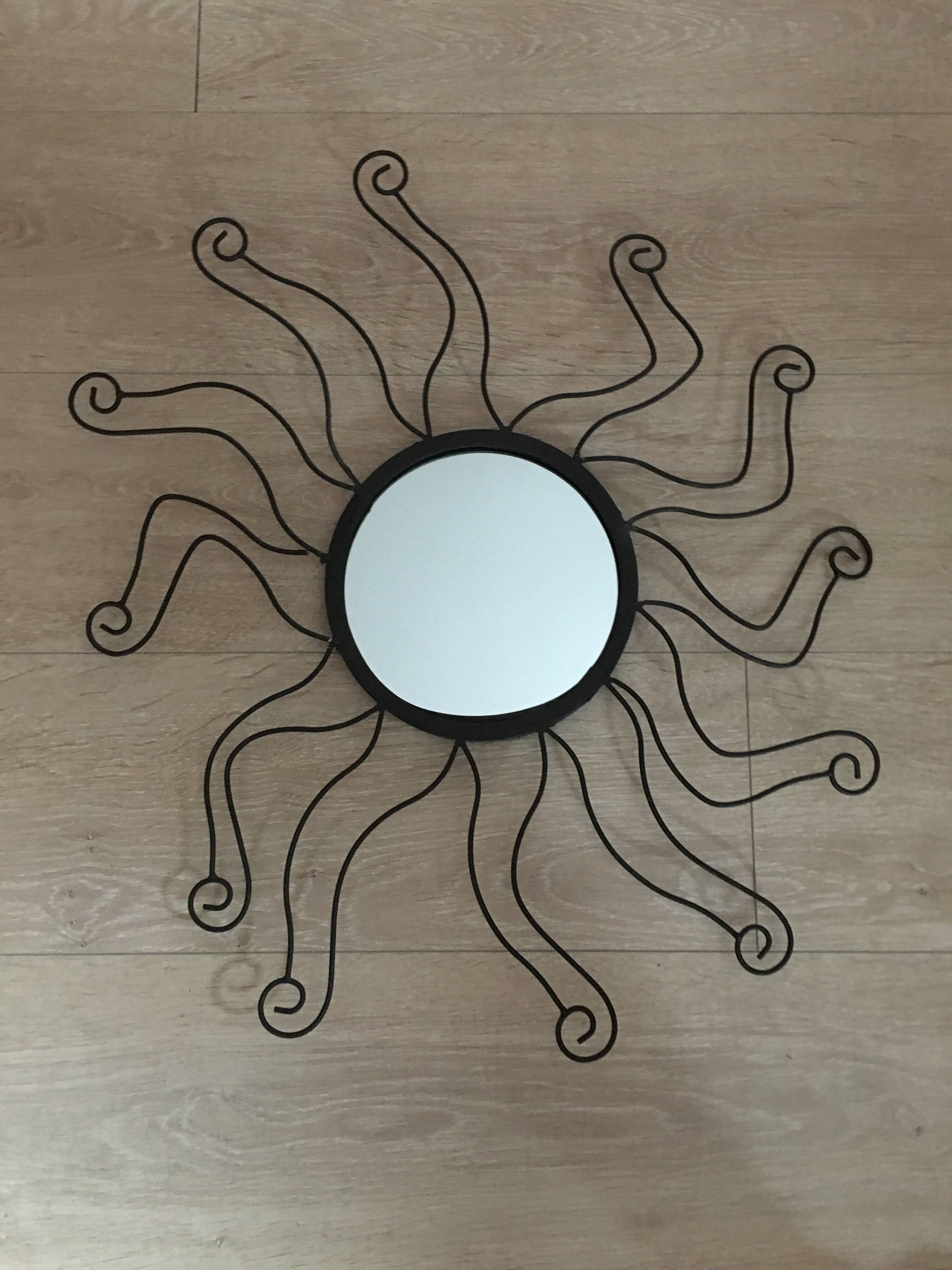 Black metal sun mirror