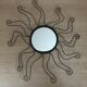 Black metal sun mirror