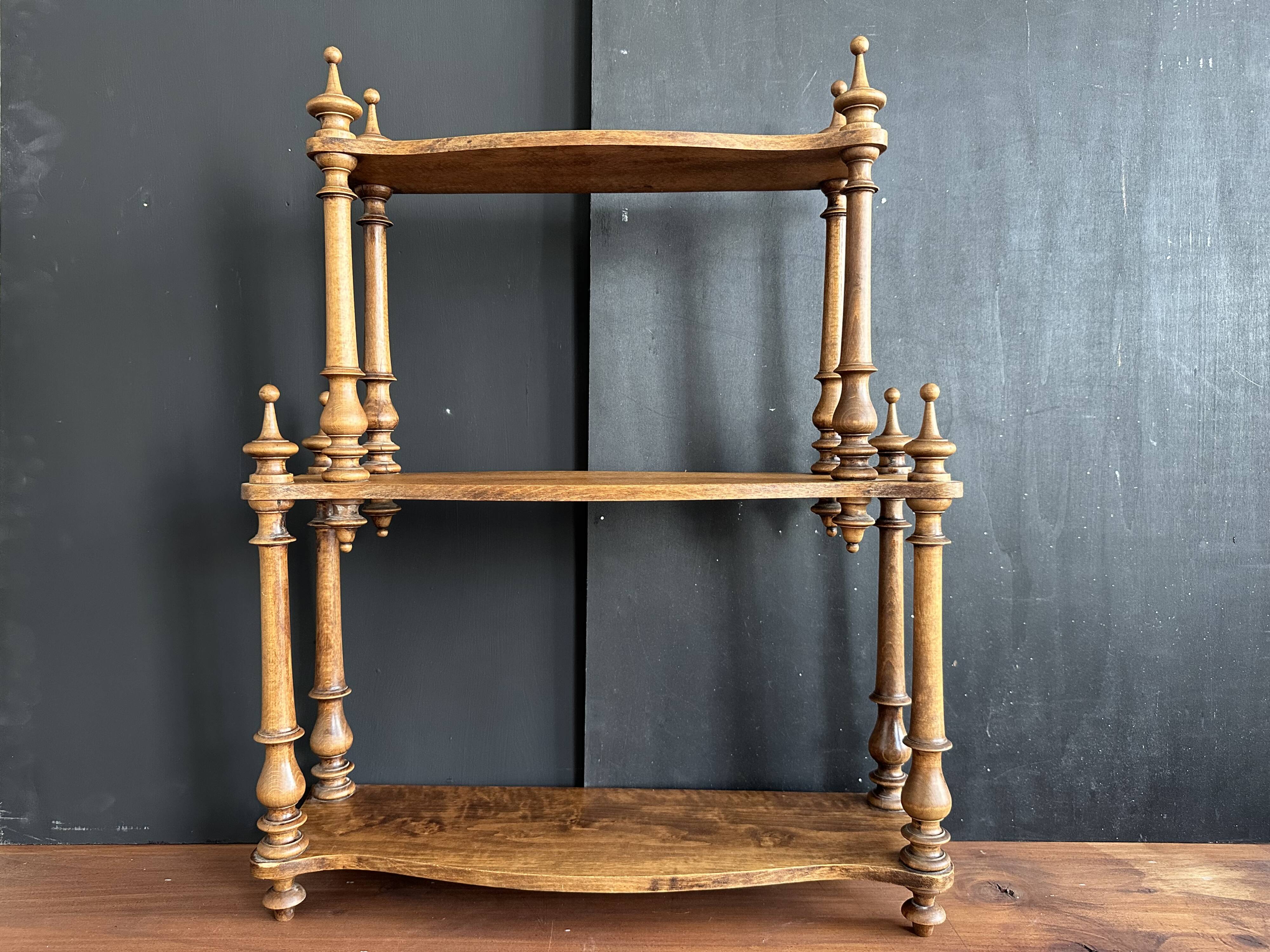 Antique turned wooden shelf with three levels, around 1900.