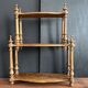 Antique turned wooden shelf with three levels, around 1900.