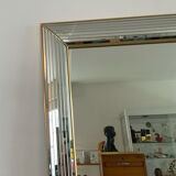 Large vintage Hollywood Regency style mirror with shutters.