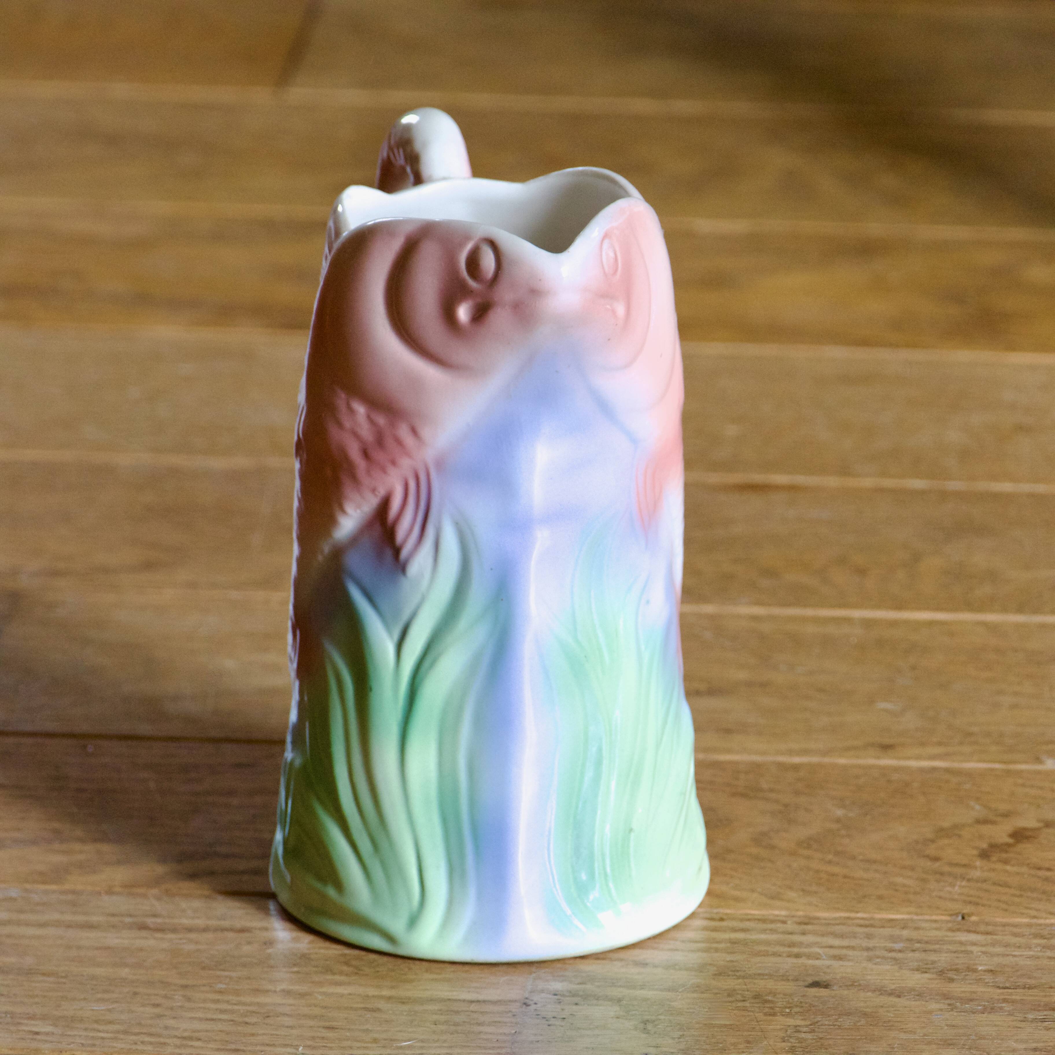 Vintage carafe in colorful fish slip