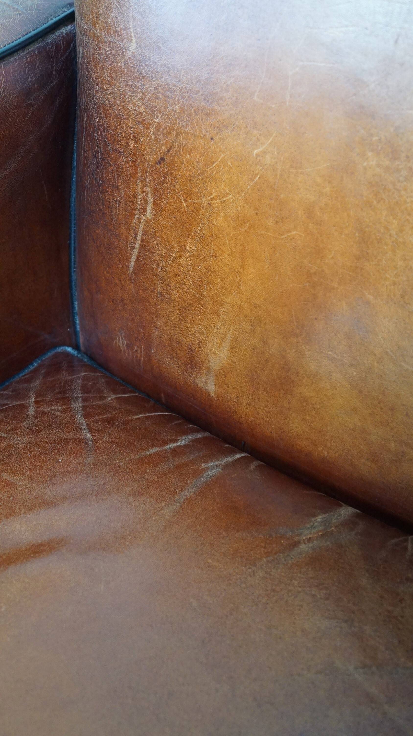 Sheepskin Art Deco design armchair with wood and beautiful cognac-colored leather