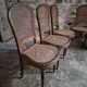 Set of 6 antique Louis XVI style dining chairs with caning.