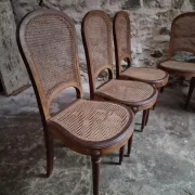 Set of 6 antique Louis XVI style dining chairs with caning.