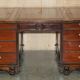Partner desk with two carved columns featuring lion heads, according to Thomas Chippendale, restored.