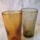 2 water glasses or blown cocktail glasses