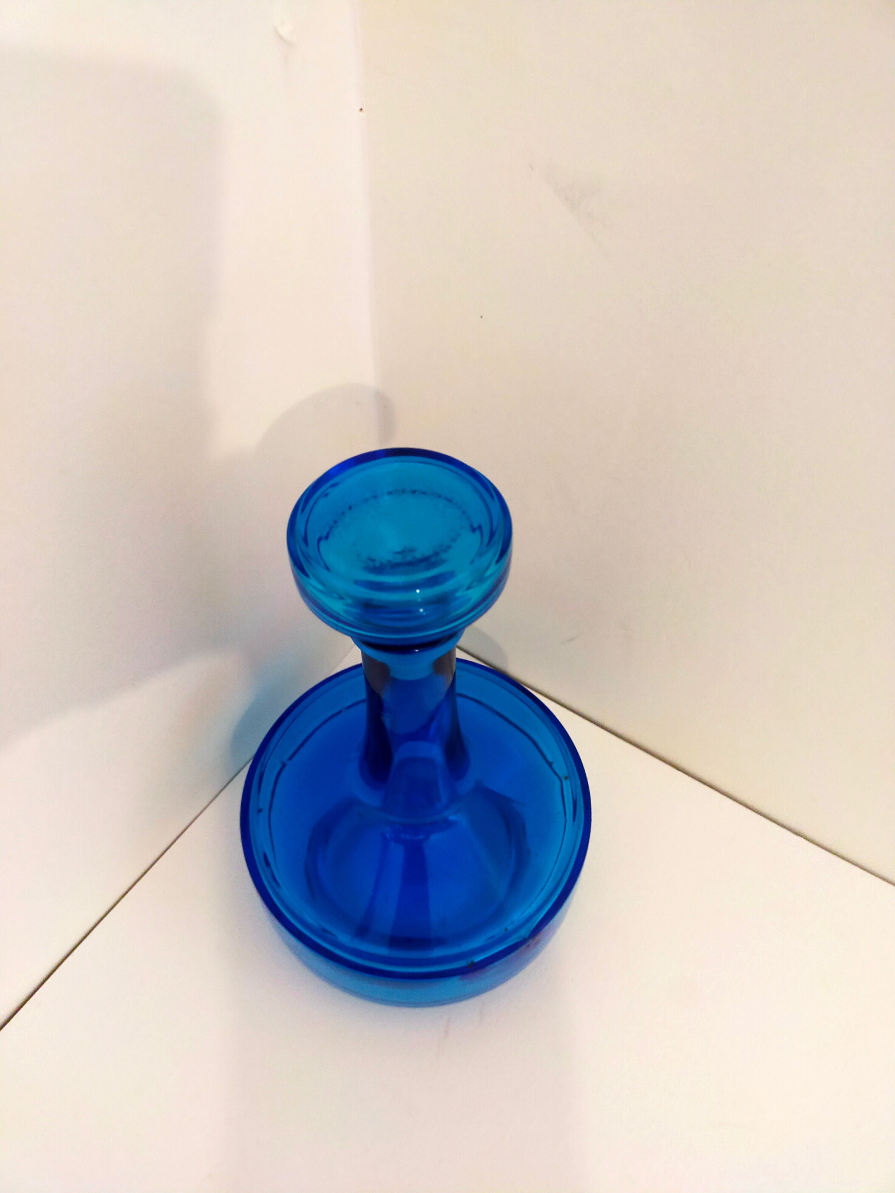 Bottle of old perfume of blue color