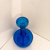 Bottle of old perfume of blue color