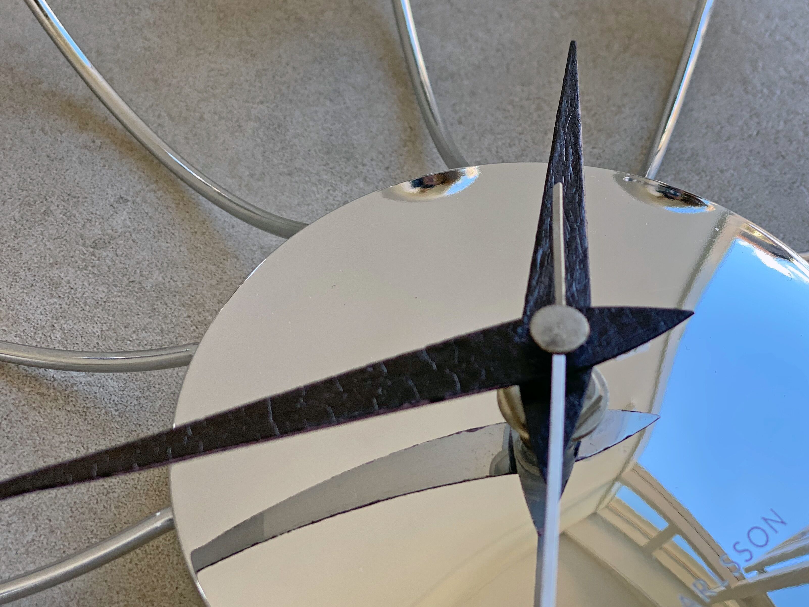 Chrome Karlsson spider wall clock with black hands, sputnik space age