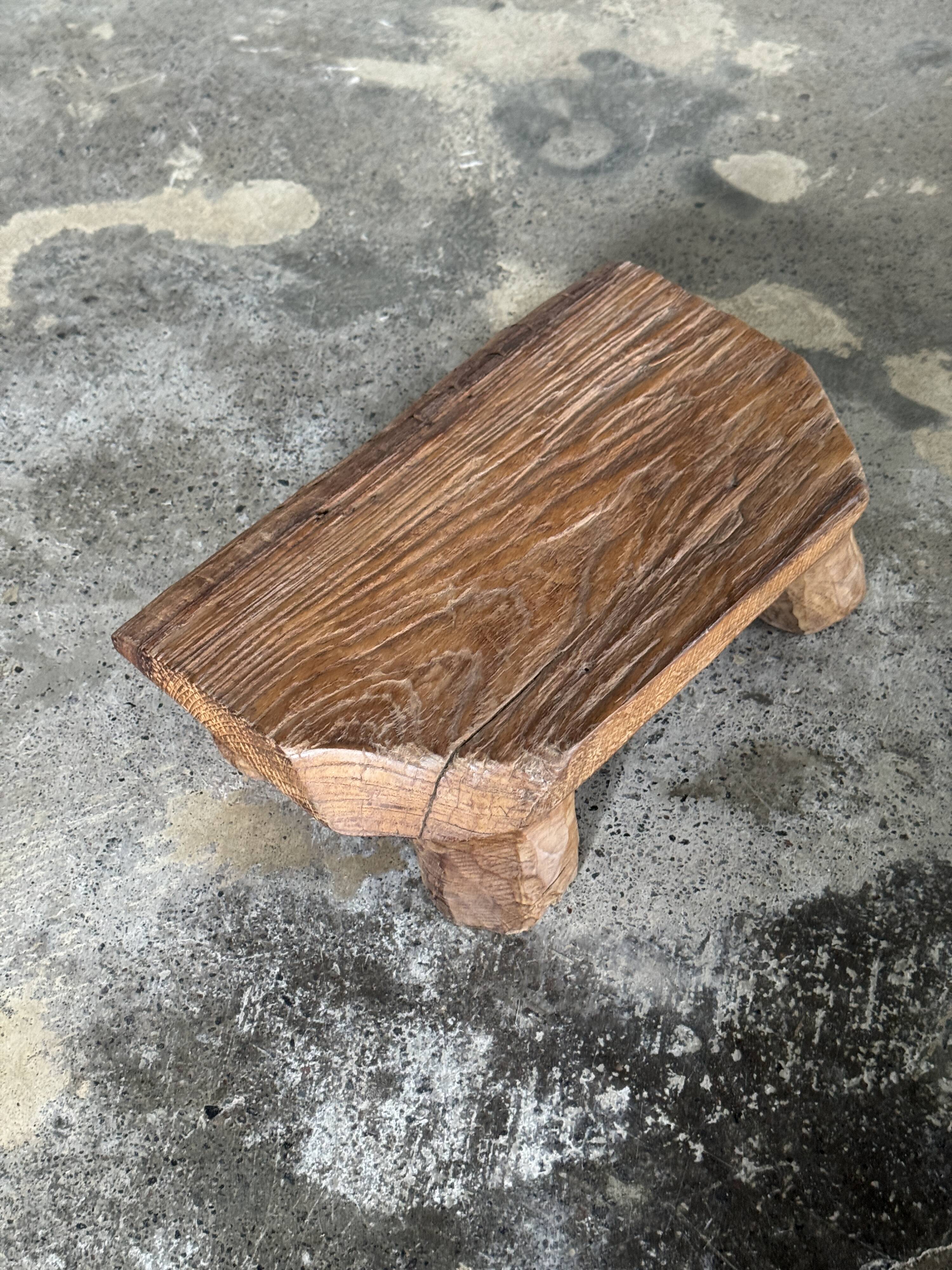 Small stool, teak footrest with short cut corners.