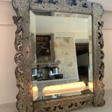 Eventful beveled mirror and openwork period 1900 repelled tin decoration