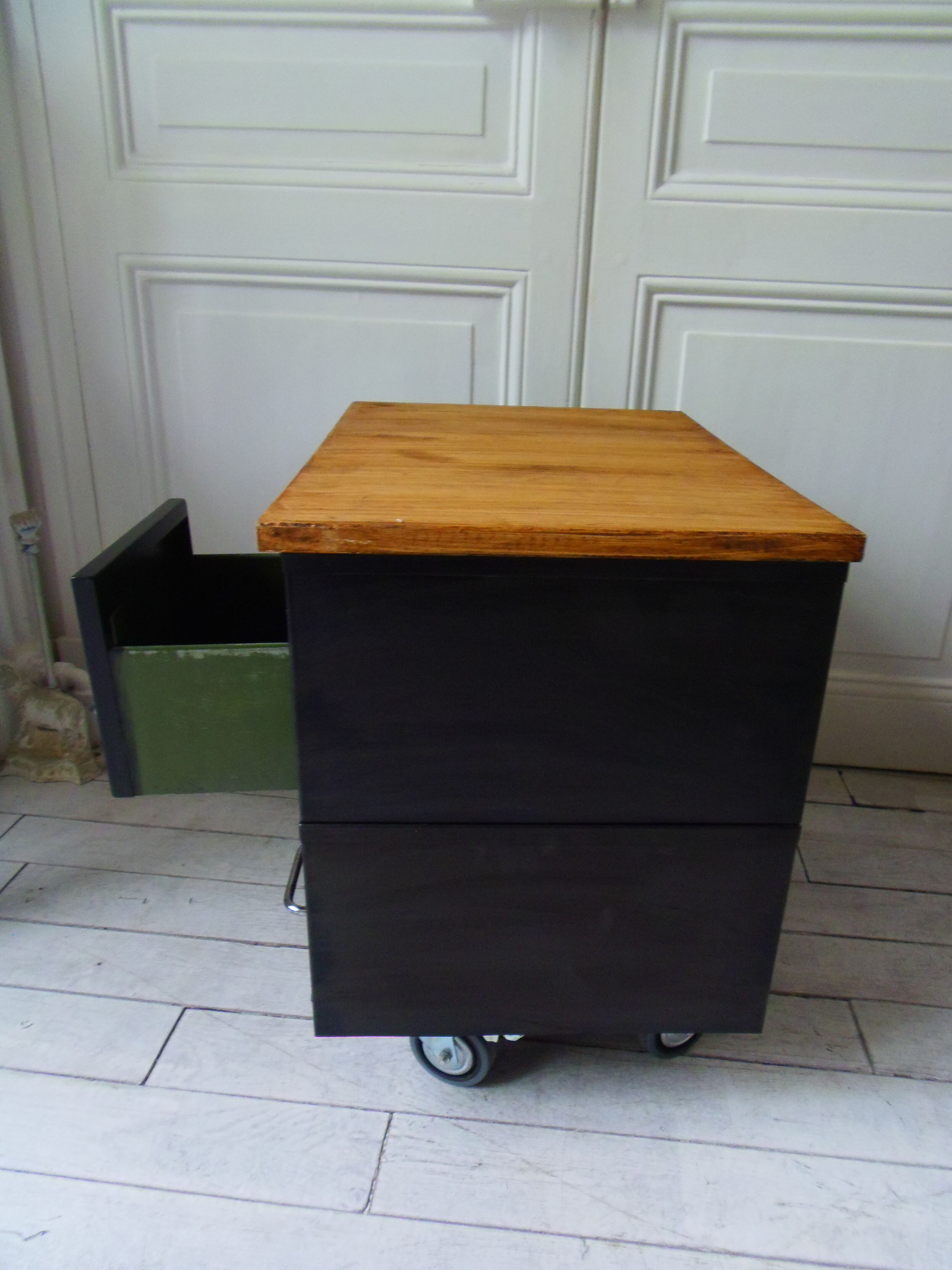 Vintage furniture with metal plugs on black wheels wooden tray
