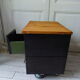 Vintage furniture with metal plugs on black wheels wooden tray
