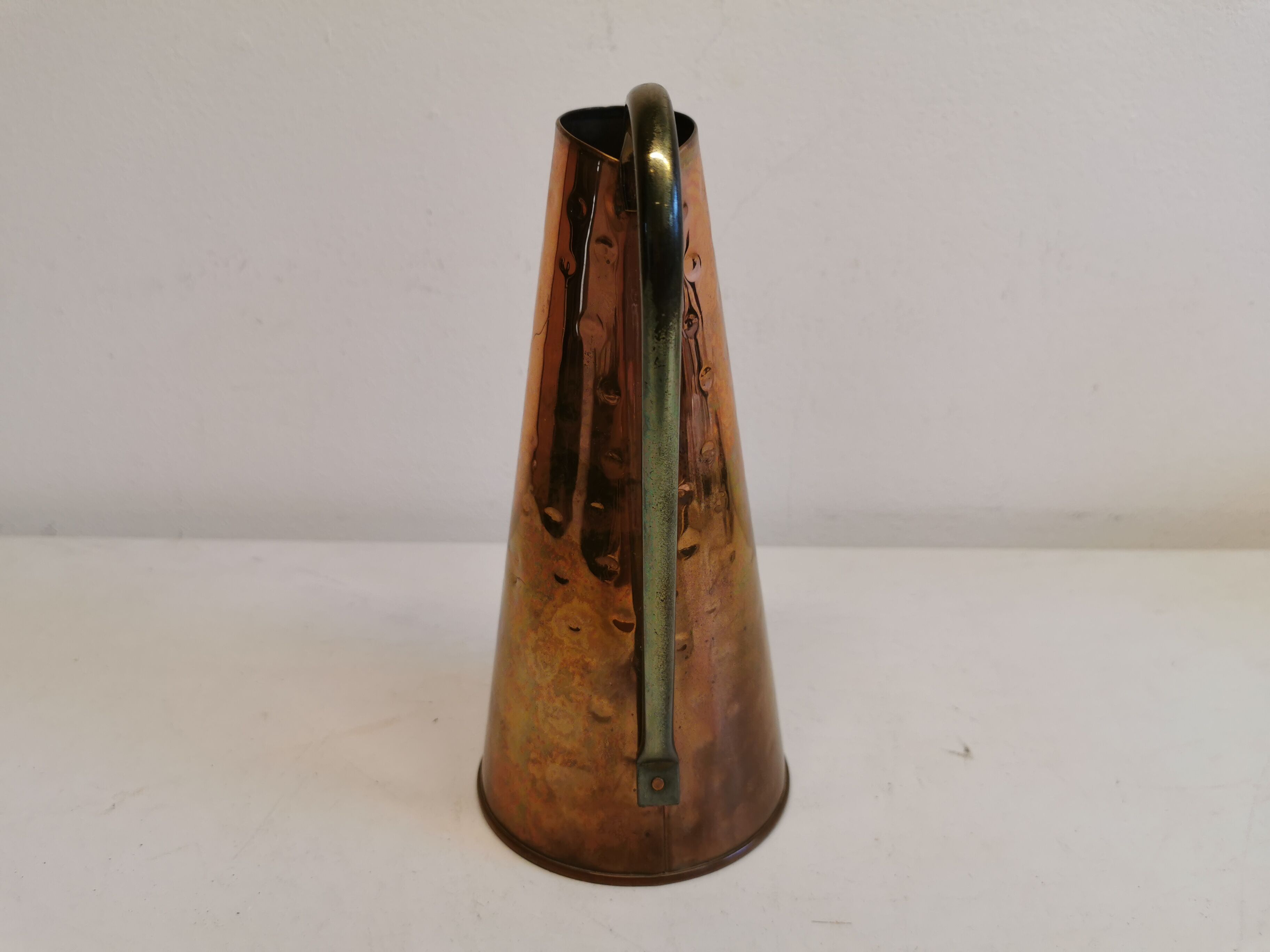 Watering can from the 1950s, made of hammered copper and brass