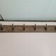 wooden school coat rack and iron hooks
