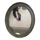 Patinated oval mirror
