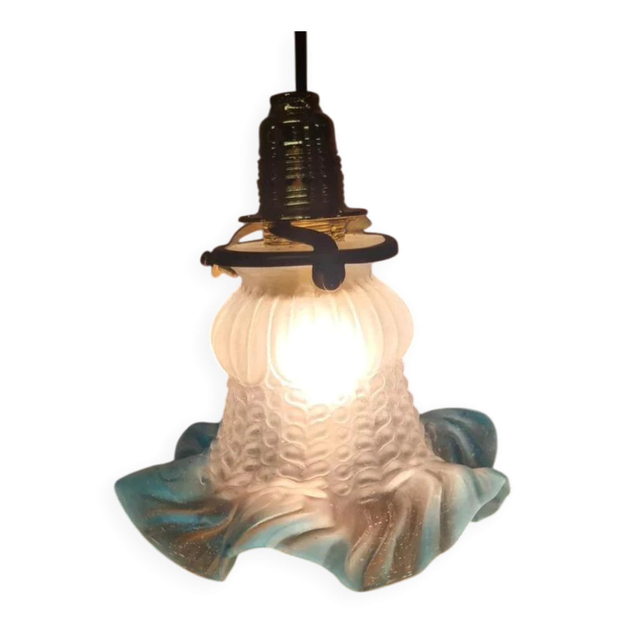 An antique lampshade in frosted glass with delicate blue edges.