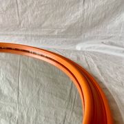 Vintage round wall mirror in orange painted wood - diameter: 48 cm