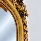 Large gold full-length mirror with ornate crest