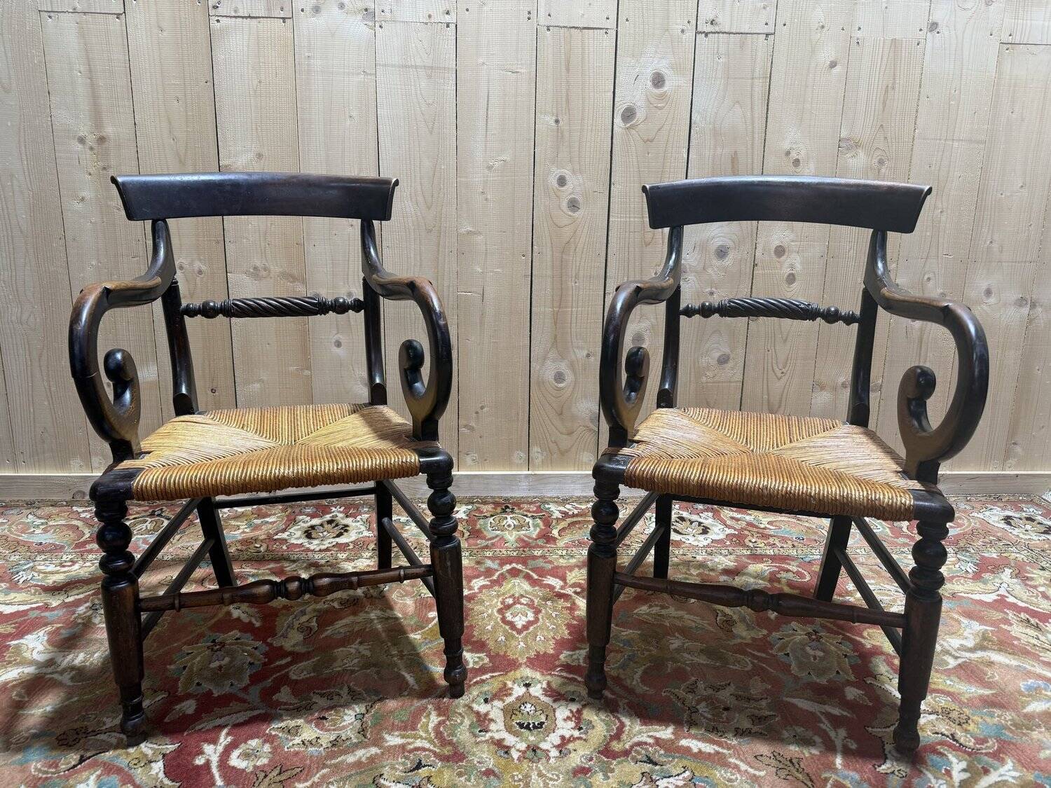 Pair of rustic straw-seated armchairs