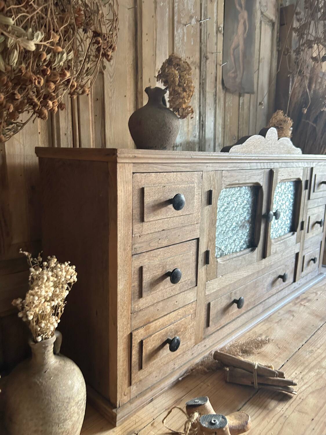 Small piece of furniture with glass doors and drawers