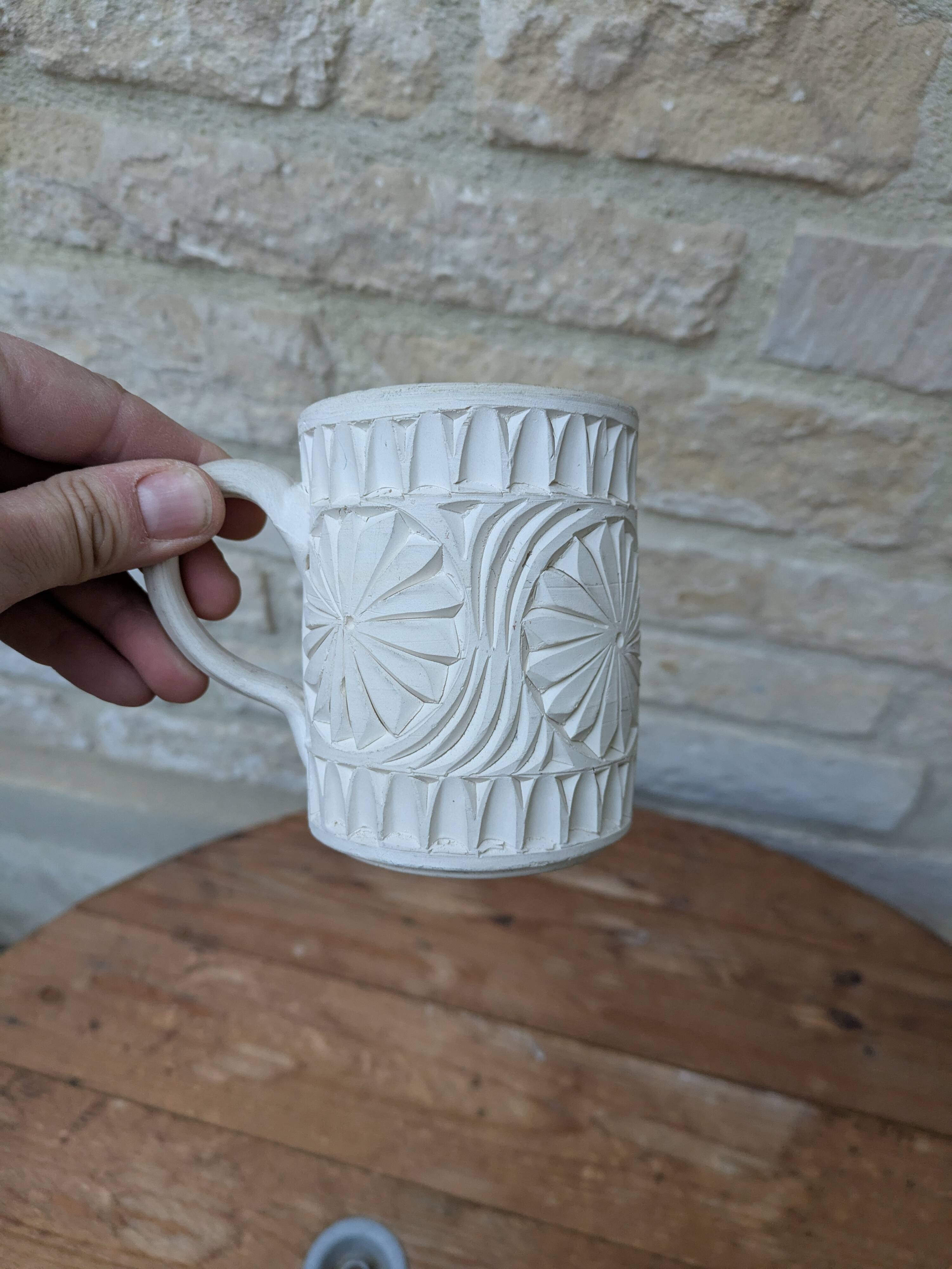 Old terracotta mug with glazed interior