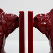 Pair of red glazed ceramic Bison ox bookends in Art Deco style, Belgium