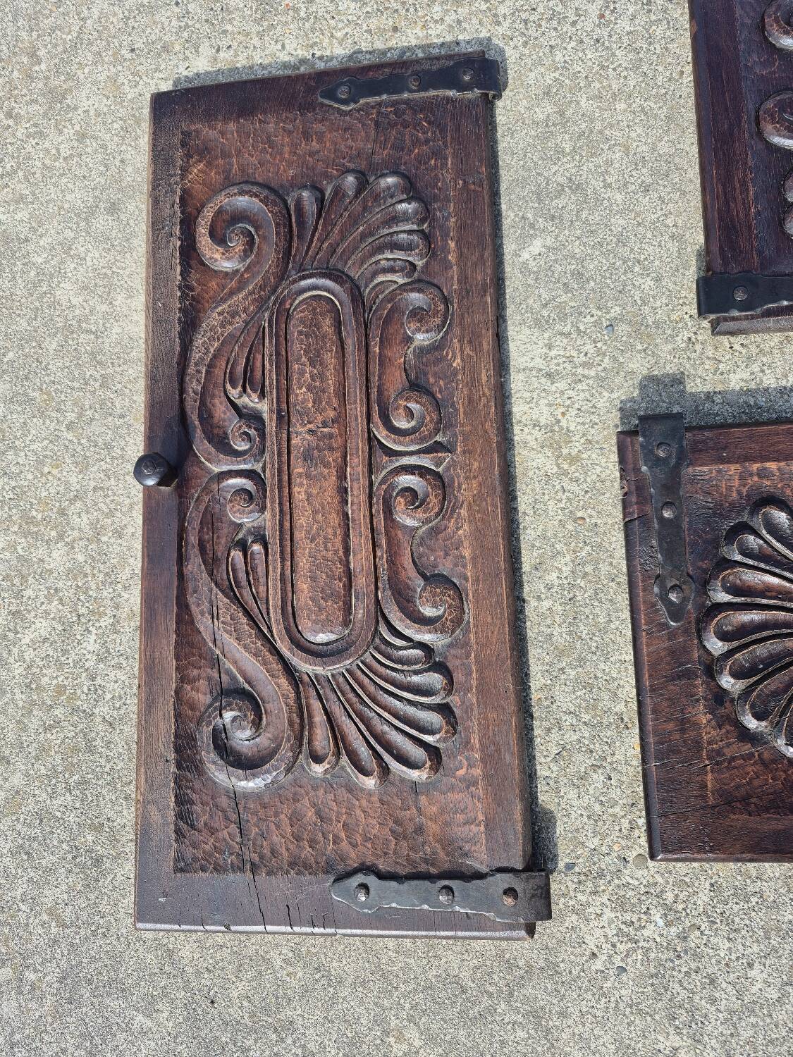 antique cabinet with carvings and wrought iron fittings rural