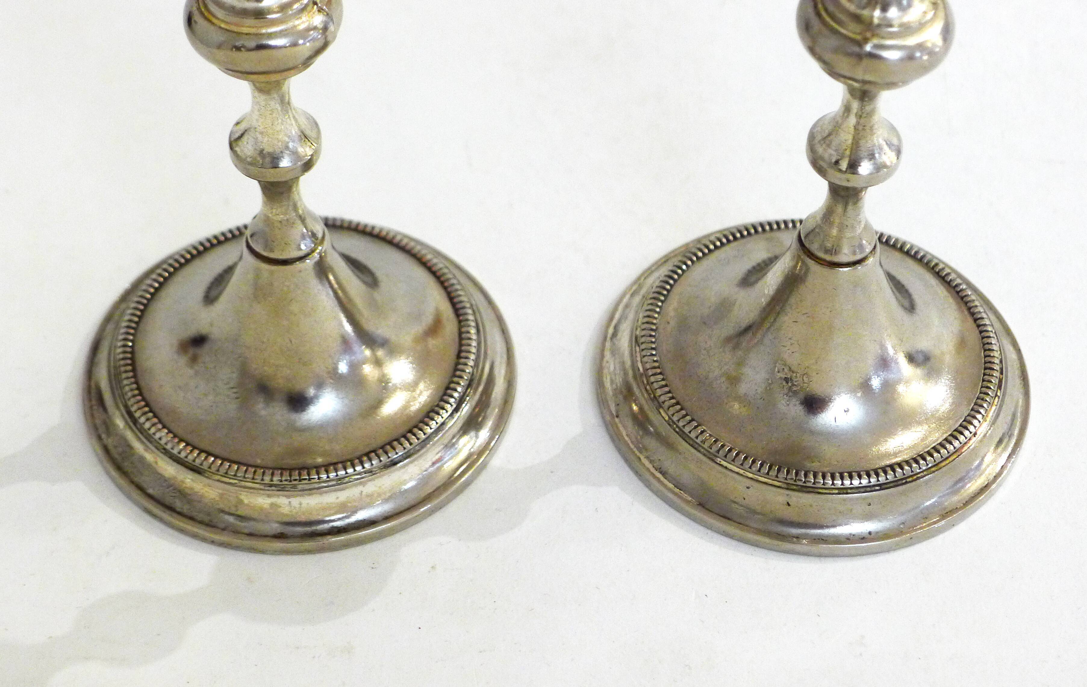 Pair of metal candle holders
