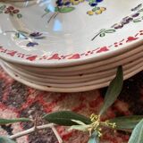 7 hand-painted flowered dinner plates.