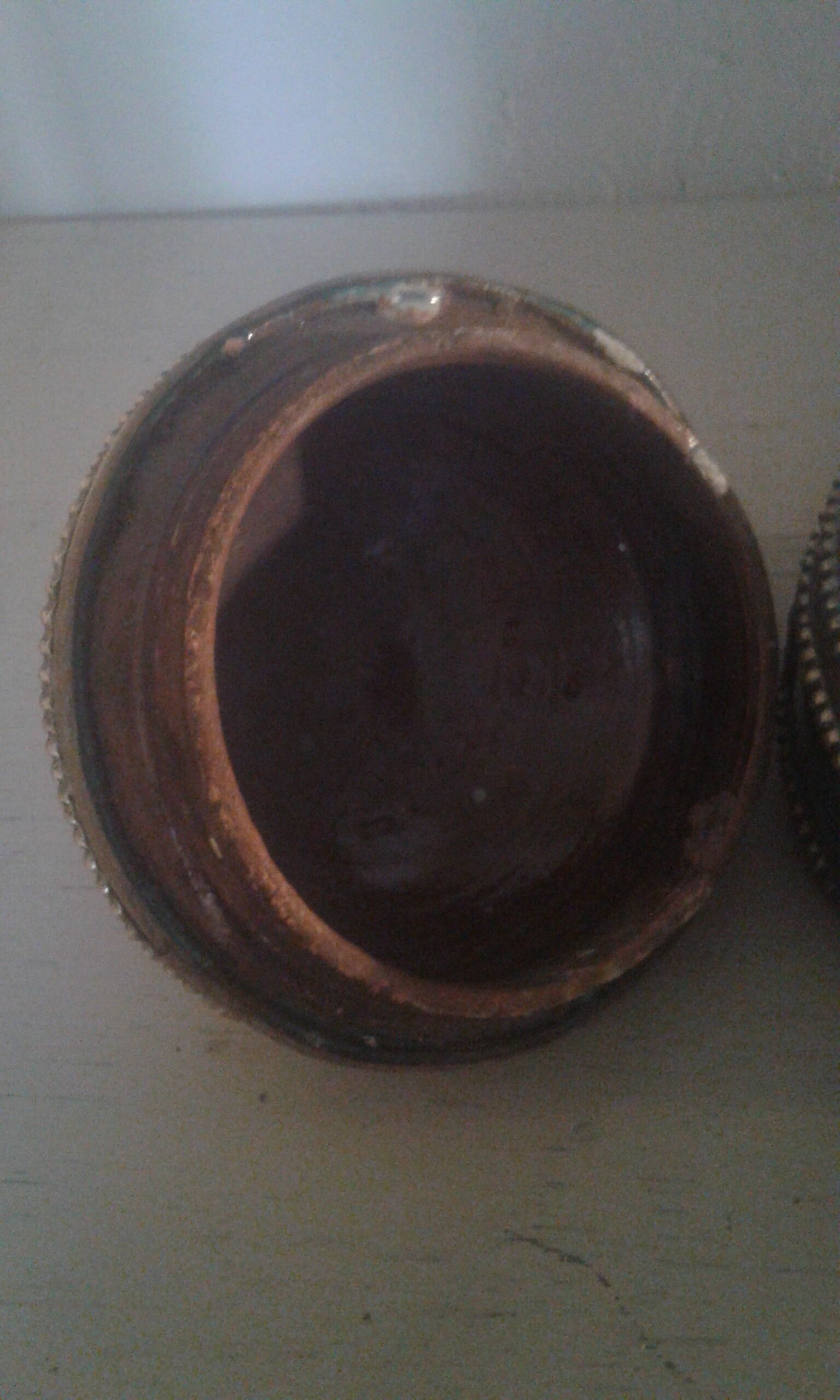 Ancient box in ceramic and enamel surrounded by brass