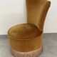 Ochre and fringed pouffe-style armchair