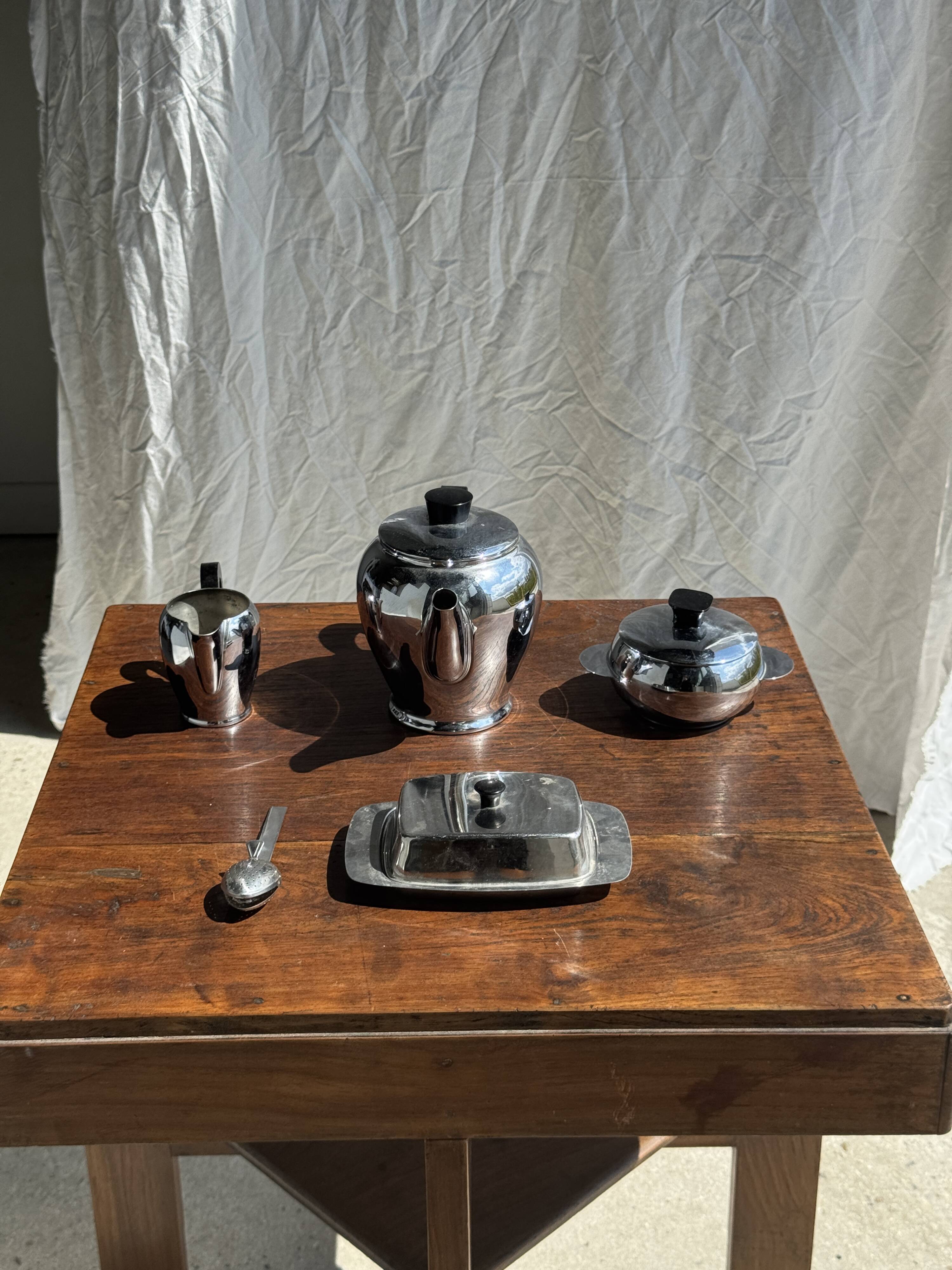 Tea set including teapot, milk jug, sugar bowl and butter dish