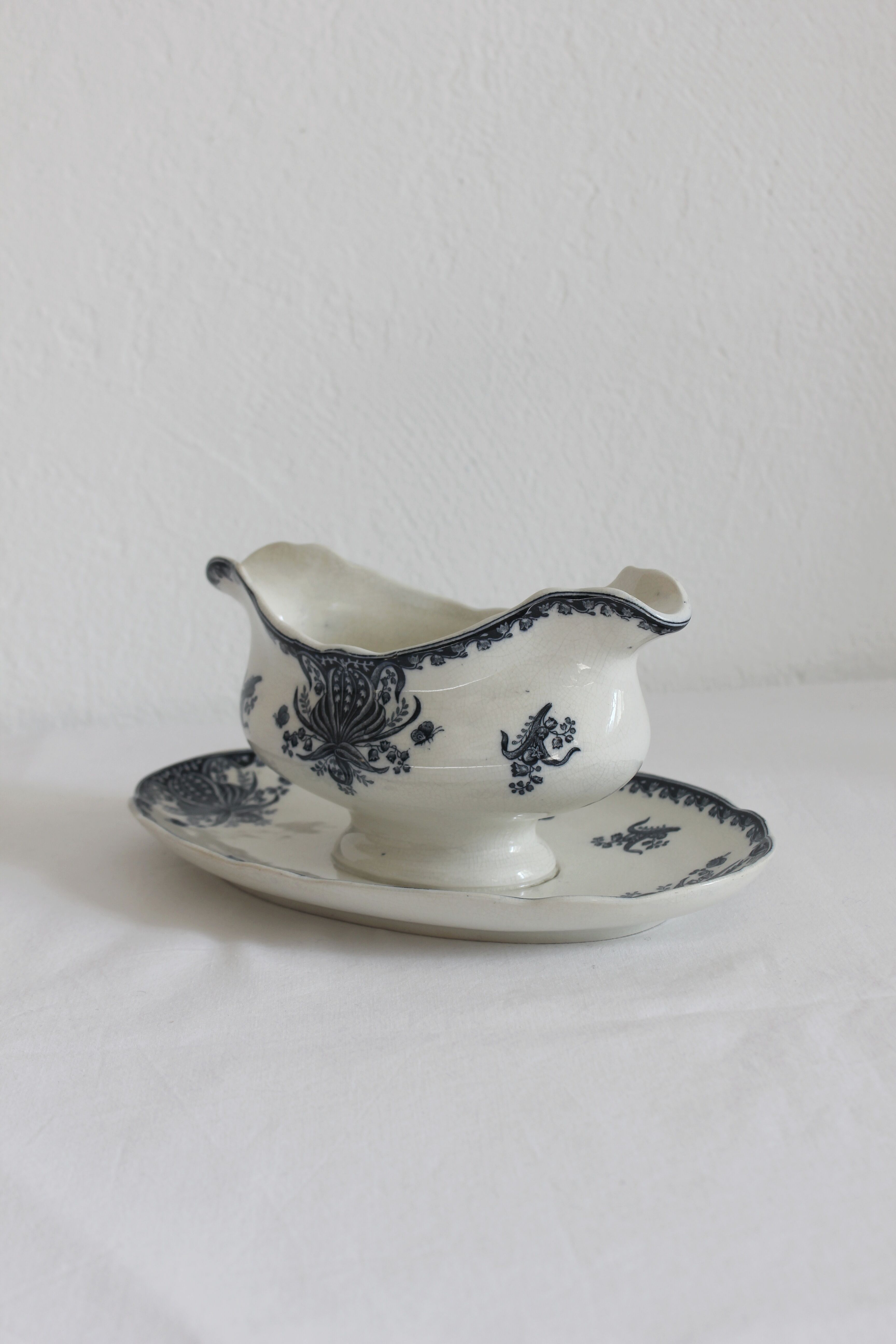 Ironware sauce boat with blue palmette decoration