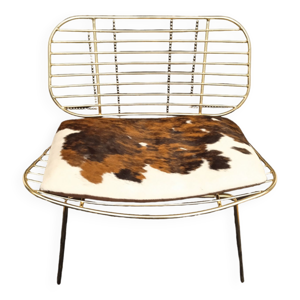 Fauteuil fil design doré coussin peau de vache