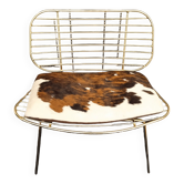 Fauteuil fil design doré coussin peau de vache