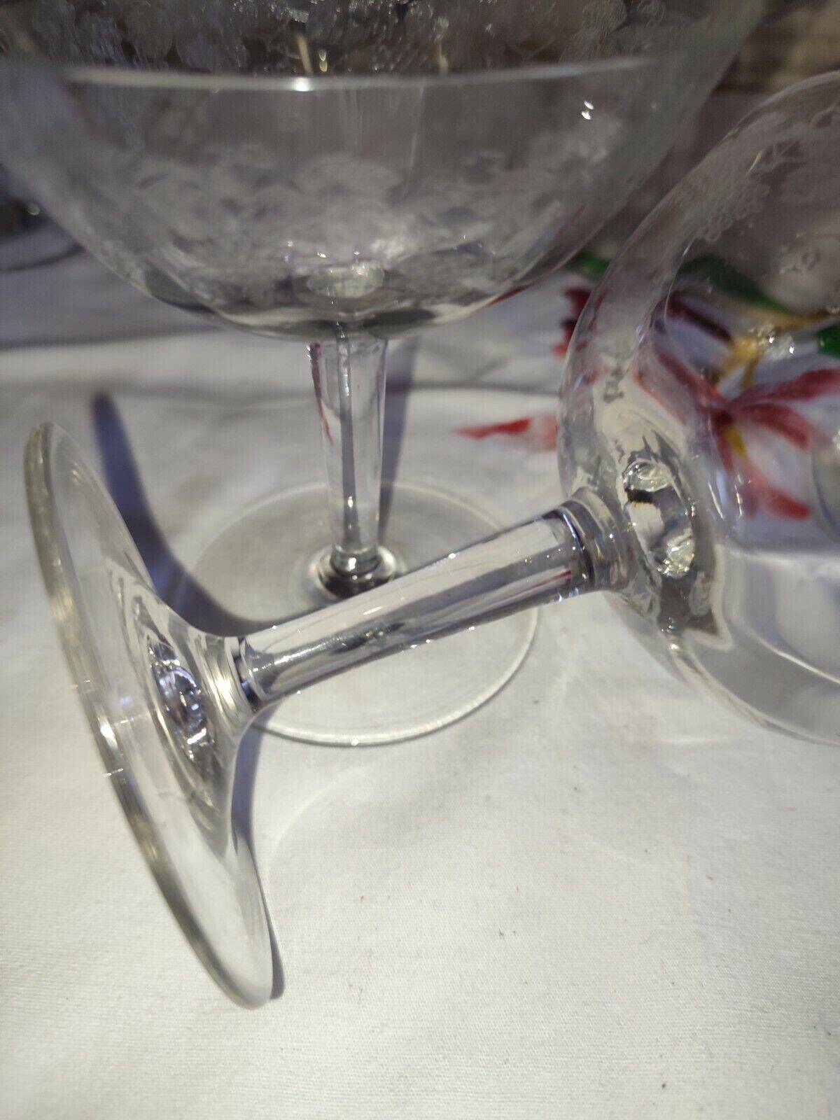 Beautiful set of seven crystal champagne glasses engraved with vine branches