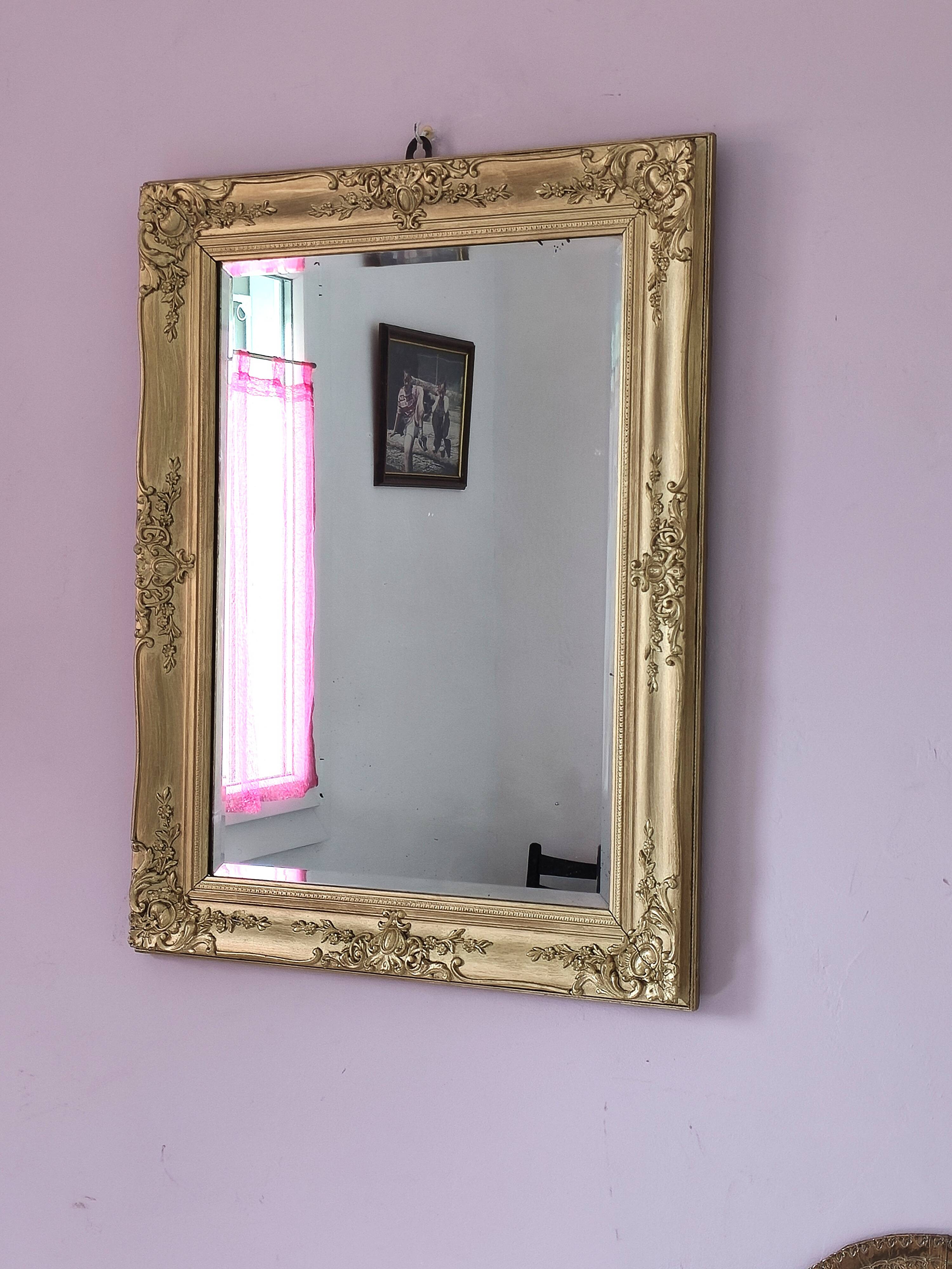 Richly carved antique gilded mirror