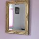 Richly carved antique gilded mirror